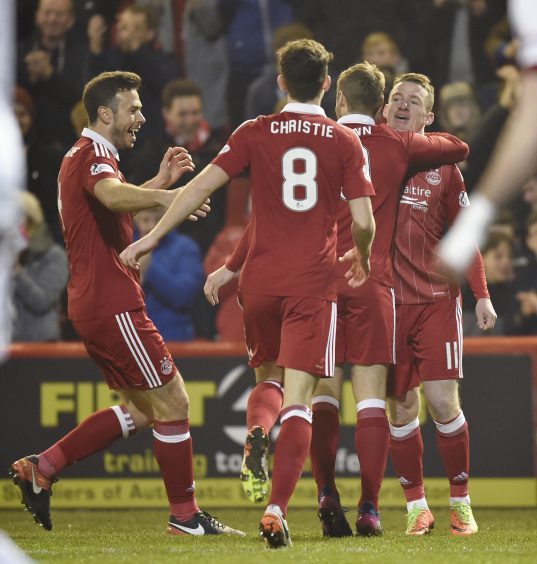 Aberdeen celebrate as Jonny Hayes (R) scores an early goal to take the lead
