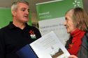 Dufftown resident Jean Oliver, right, confronts EDF's project manager Darren Cuming about the plans.
