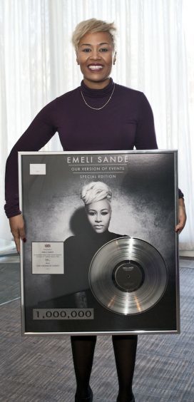 Emeli Sande with disc celebrating her 1 million album sales in 2012.
