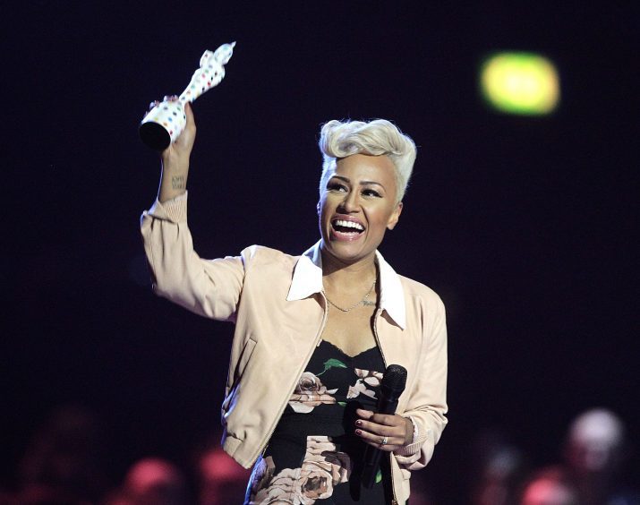 Emeli Sande collects the Best British Album award from Bryan Ferry during the 2013 Brit Awards at the O2 Arena, London.