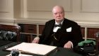 Winston Churchill in the cabinet room at 10 Downing Street- a new essay has revealed his thoughts about the possibility of alien life