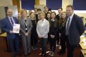 Willie Wood HR Director of Johnstons and chair of DYW Moray; Moira Stickle manager DYW Moray; Gail Cleaver retail sales and operations manager and Simon Cotton, chief executive Johnstons of Elgin with pupils from Lossiemouth High School.