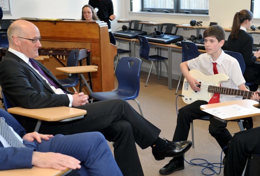 John Swinney, during a visit to the music department.