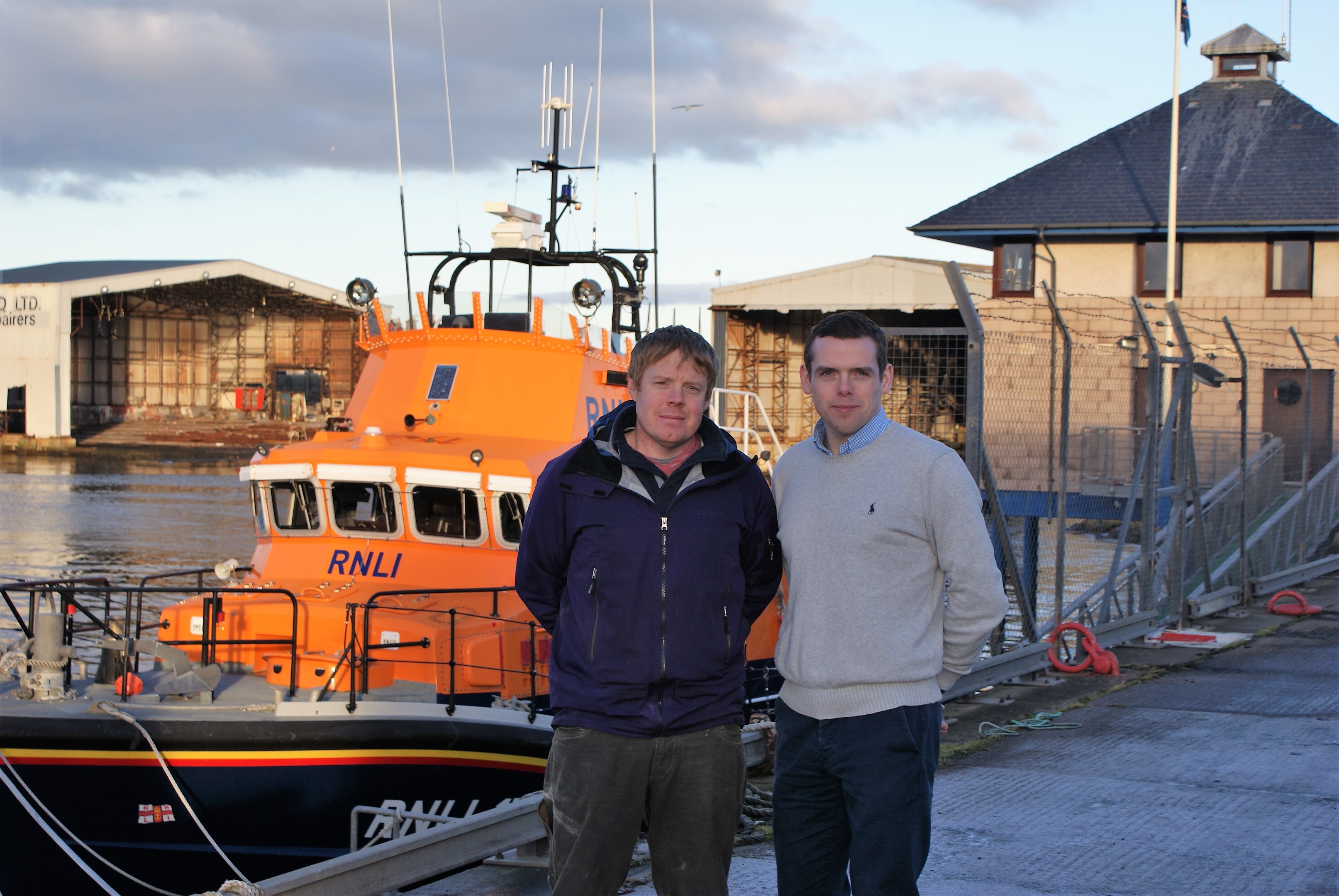 Buckie local election candidate Tim Eagle with Highlands and Islands MSP Douglas Ross at the town's harbour.