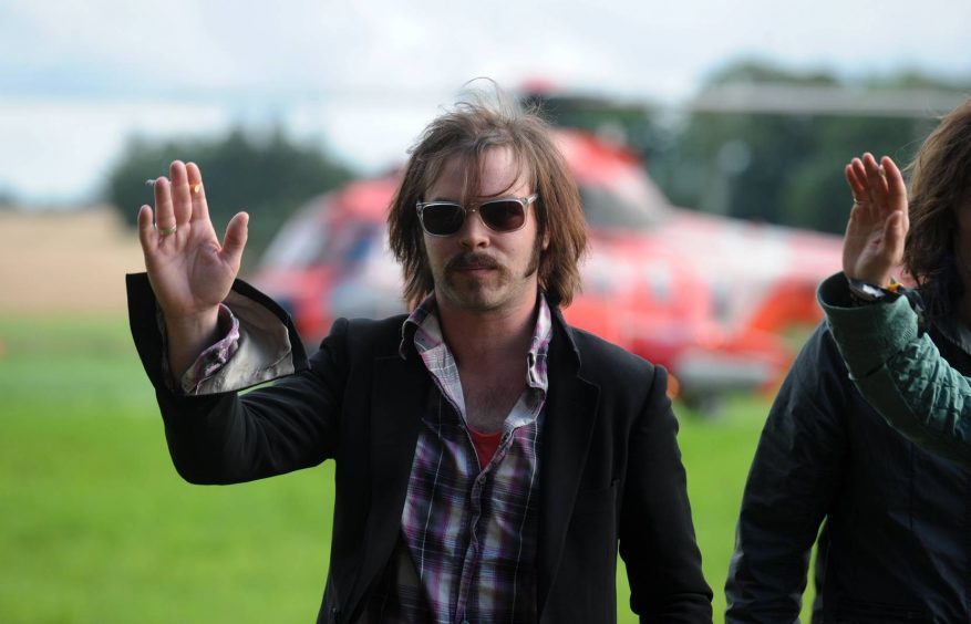 Gaz from headlining act Supergrass arriving by helicopter at the Wizard festival in New Deer in 2008.