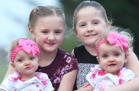 Older sisters Charlotte and Isabelle with new arrivals Erin and Leah