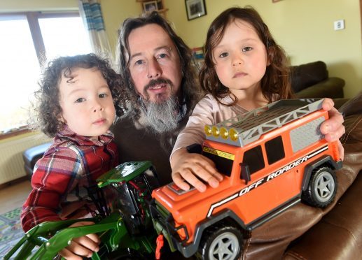 Three year old twins, Lochlan & Lowenna with dad Richard Williamson at home yesterday in Badcaul, Wester Ross.