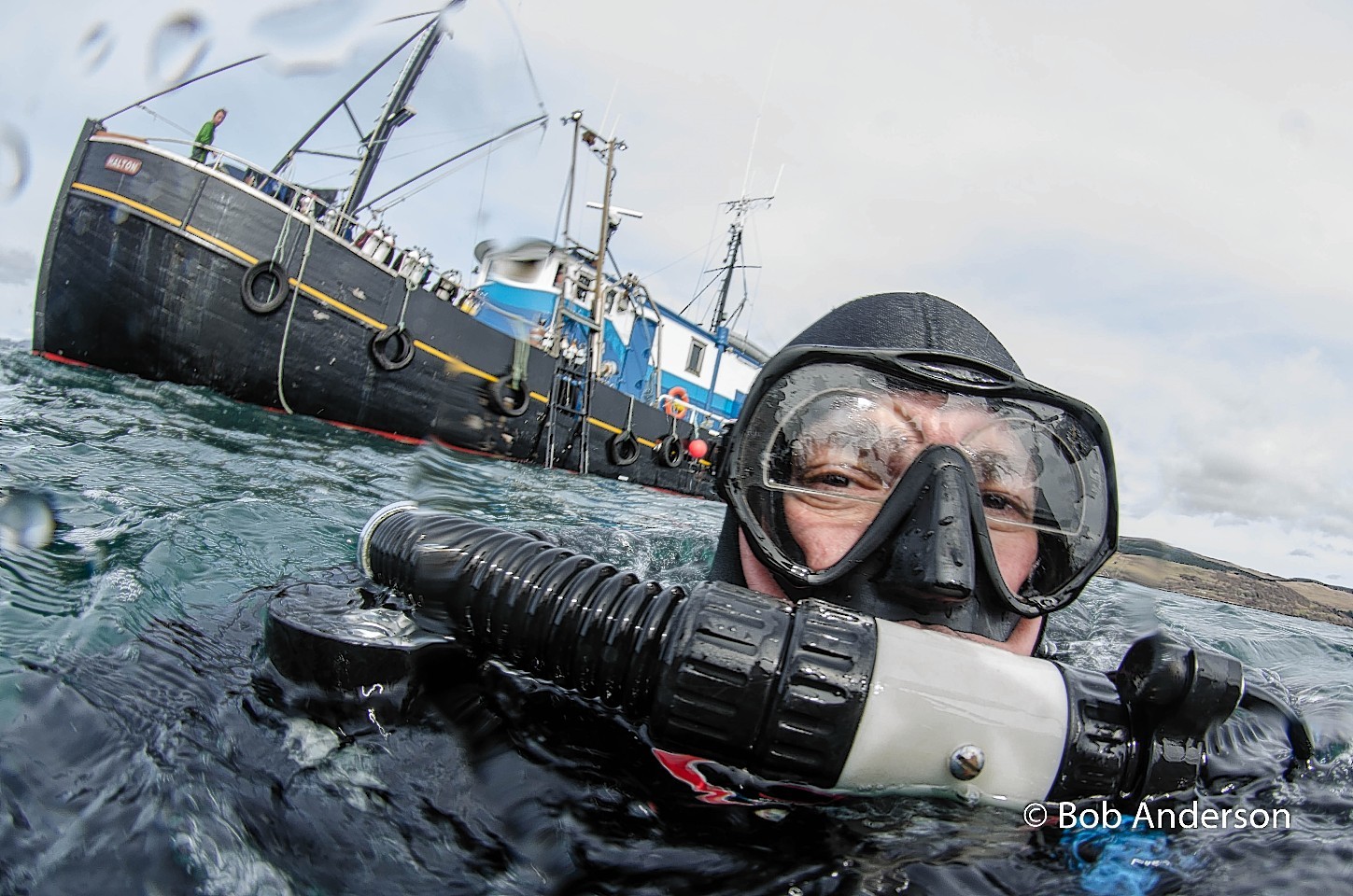 Scuba diver in Scapa Flow, preparing to map shipwrecks on sea bed.