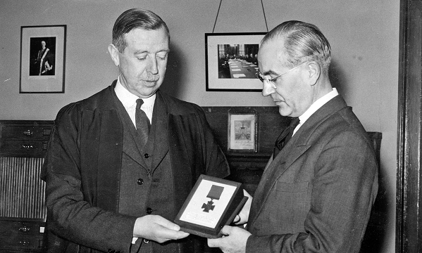 Mr DE Collier, headmaster of Robert Gordon's College, is pictured handing over the Otaki VC to Mr CB Sharpe, representative of the New Zealand Shipping Company. The VC had been awarded posthumously to Capt Archibald Bisset Smith, a former Gordon's pupil, who fought bravely against a heavily armed German ship and went down with his vessel, the Merchant Navy ship the Otaki in 1917