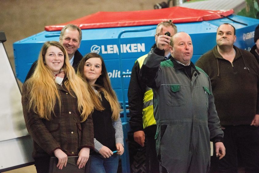 Iain Green talks about his farm with daughters Laura and Jemma to his left.