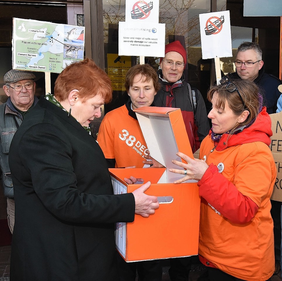 Council leader Margaret Davidson receives the symbolic petition from campaigner Joanne Paterson.