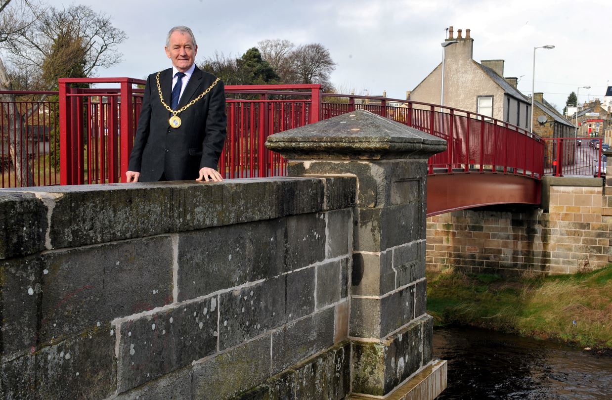 Moray Council convener Allan Wright at one of the footbridges built as part of the defences.