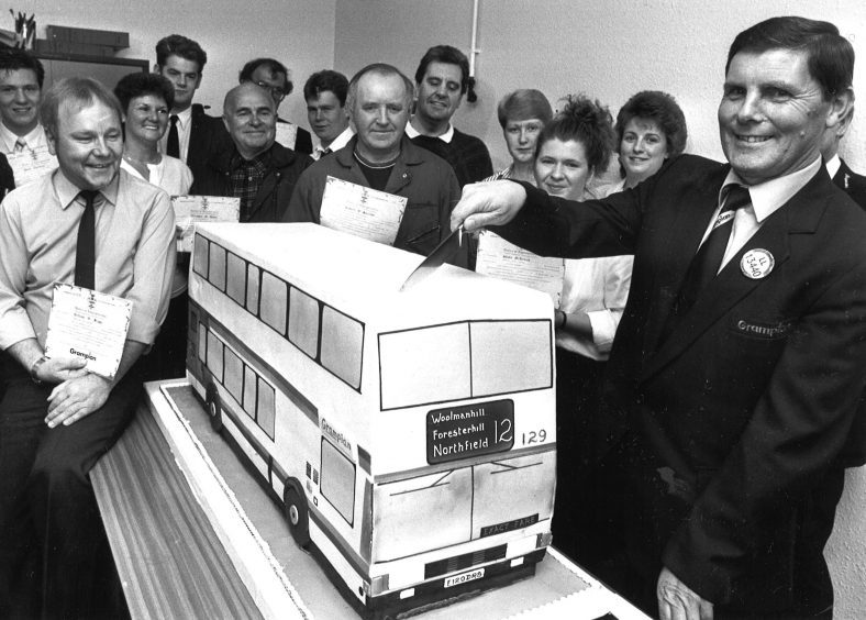 GT staff celebrate having their stake in company confirmed in 1989