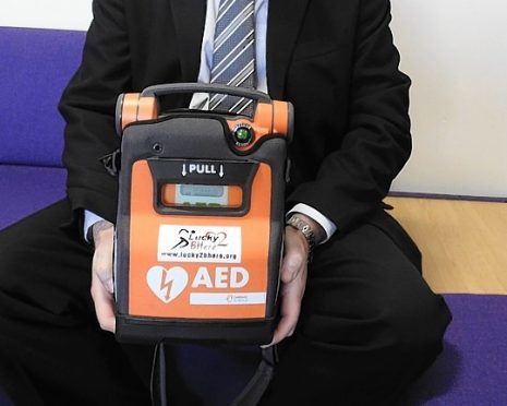 Western Isles councillor Angus Morrison with one of the lifesaving devices.