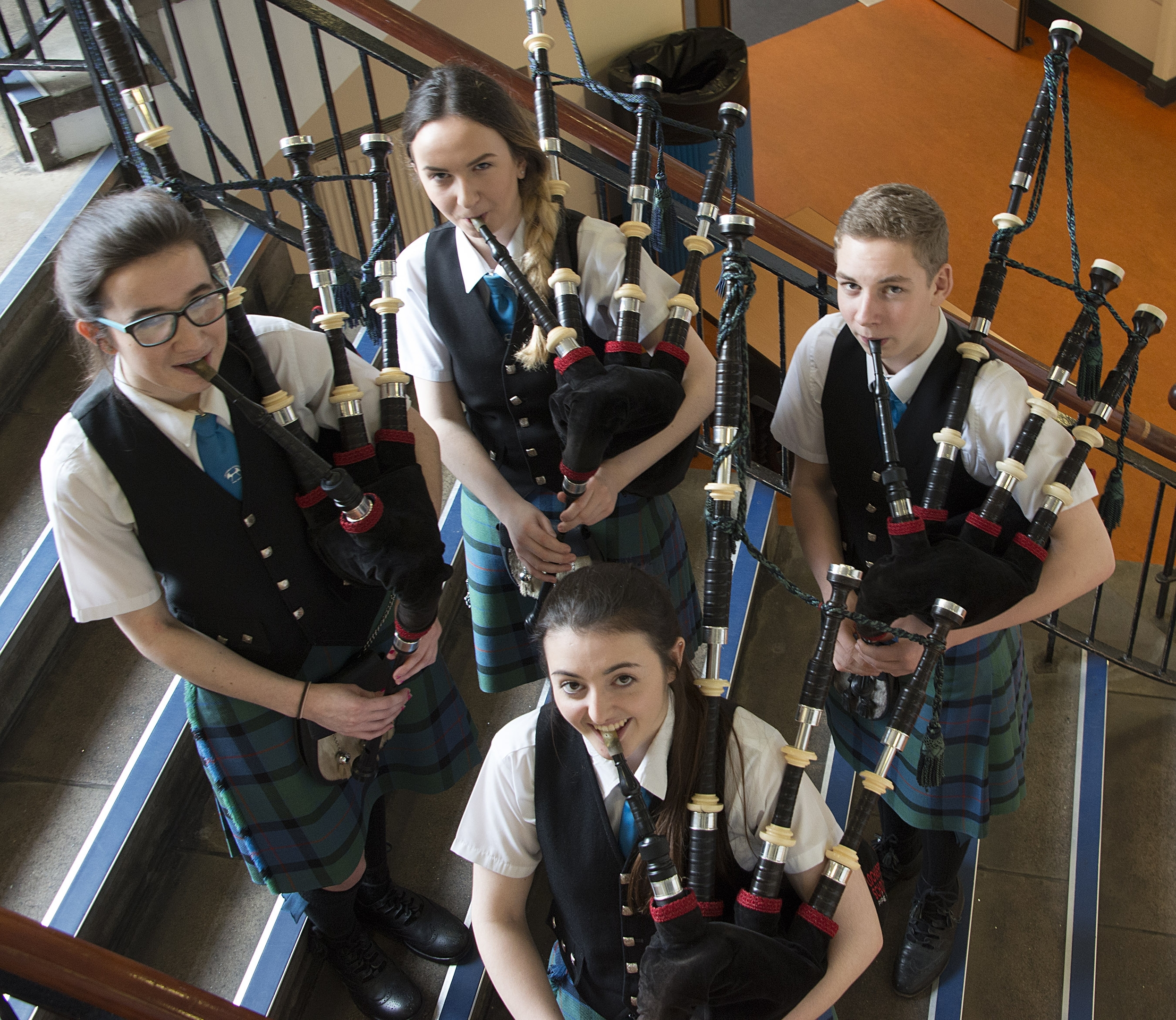 Piping Quartet winners, back row, left - rght, Sine MacRae, Amber MacDonald and Reinis Cameron with Megan Campbell.