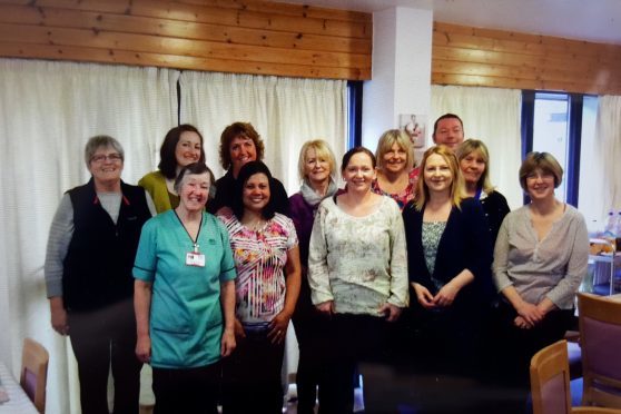 Manager Lisa Macdonald (front row second from the right) with the delighted staff of Lochbroom House, Ullapool
