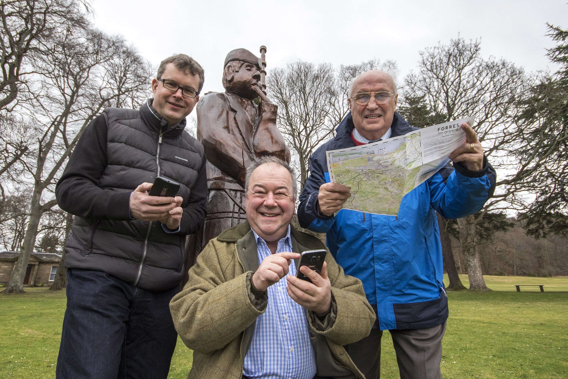 App developer David Sim, Forres Events director Eddie Tomkinson, and volunteer Paul Johnson plot their Piping at Forres day using the new trail.