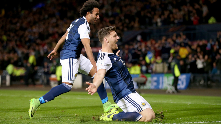 Chris Martin, right, celebrates scoring Scotland's late winner