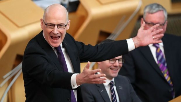John Swinney stands in for Nicola Sturgeon during First Minister's Questions at the Scottish Parliament