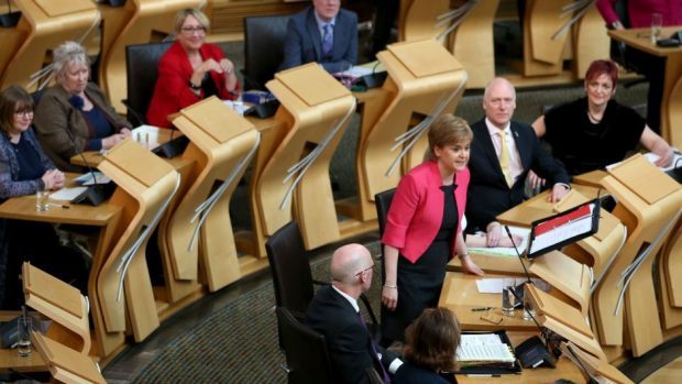Nicola Sturgeon (centre right) in the main Holyrood chamber