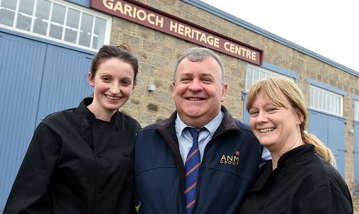 Colin Slessor flanked by co-owners of the cafe, Fiona Grant and Sylvia Beaton