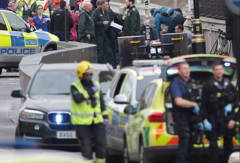 Emergency personnel close to the Palace of Westminster, London, on the day of the attack