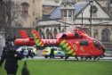 An Air Ambulance outside the Palace of Westminster, London, after sounds similar to gunfire have been heard close to the Palace of Westminster. A man with a knife has been seen within the confines of the Palace, eyewitnesses said