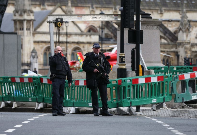 Police close to the Palace of Westminster, London,