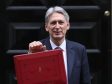 Chancellor of the Exchequer Philip Hammond holds the budget box