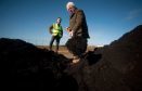 Findhorn and Kinloss community councillor Harvey Morton helps himself to the compost.