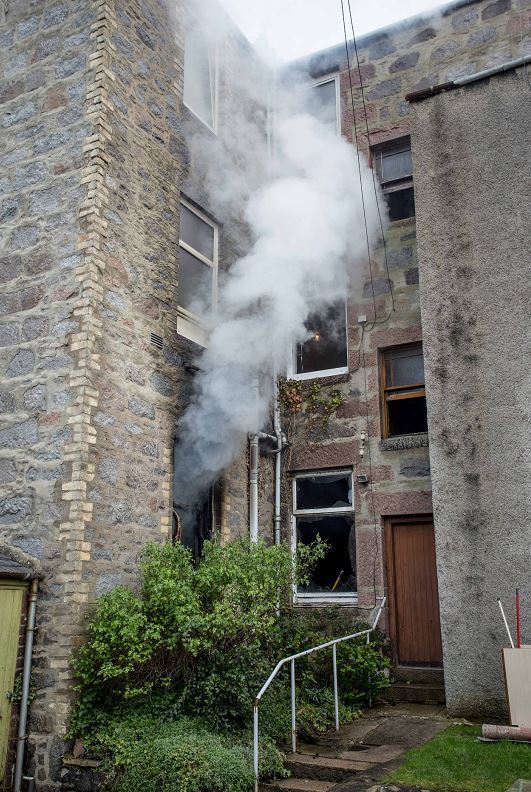 More than 20 firefighters are battling a flat fire in Aberdeen.
