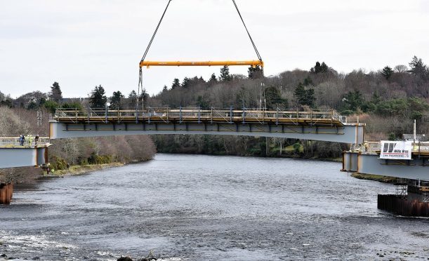 The bridge beams being lifted into place back in March