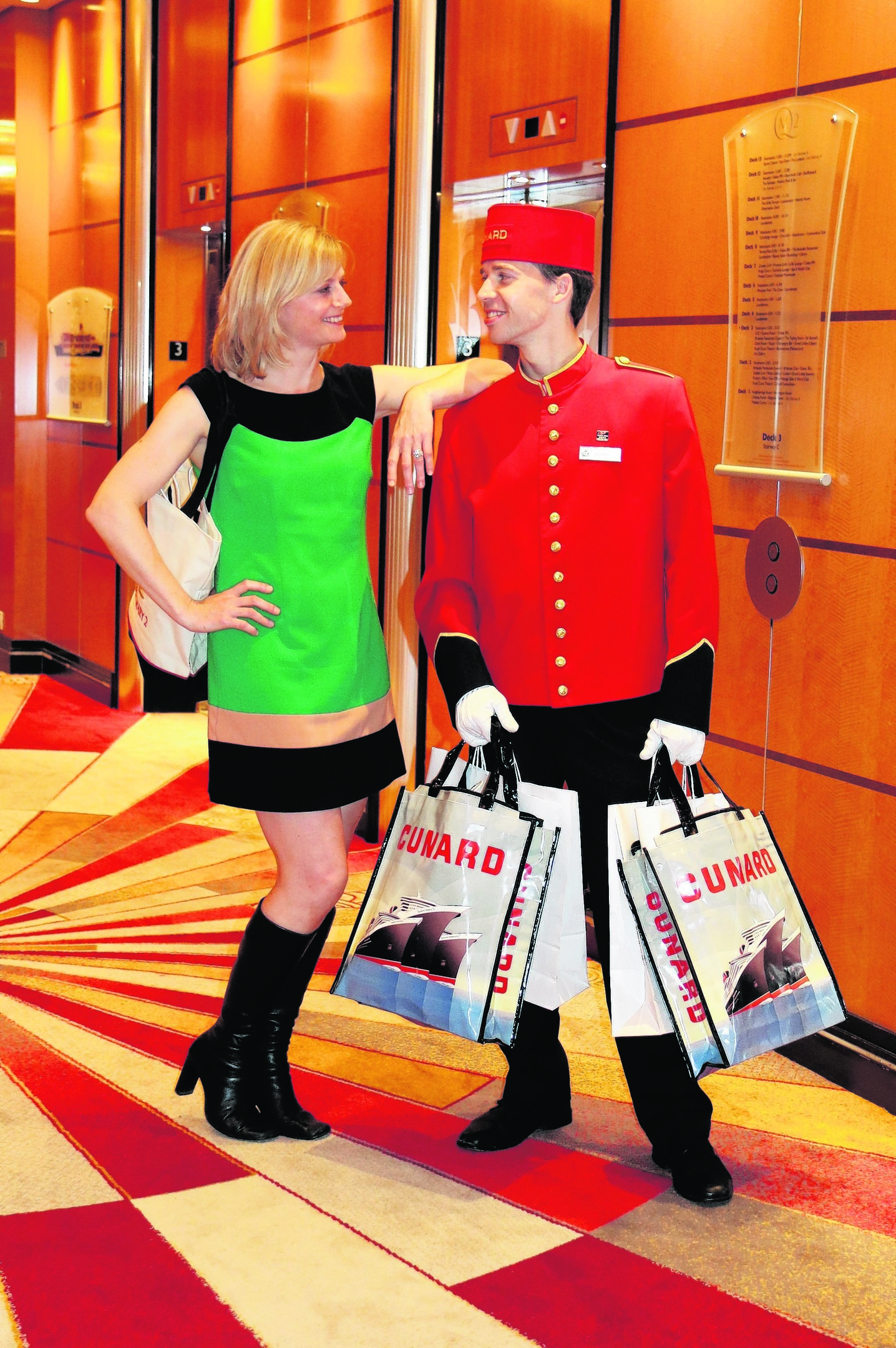 Karen and a bellboy on the Queen Mary 2
