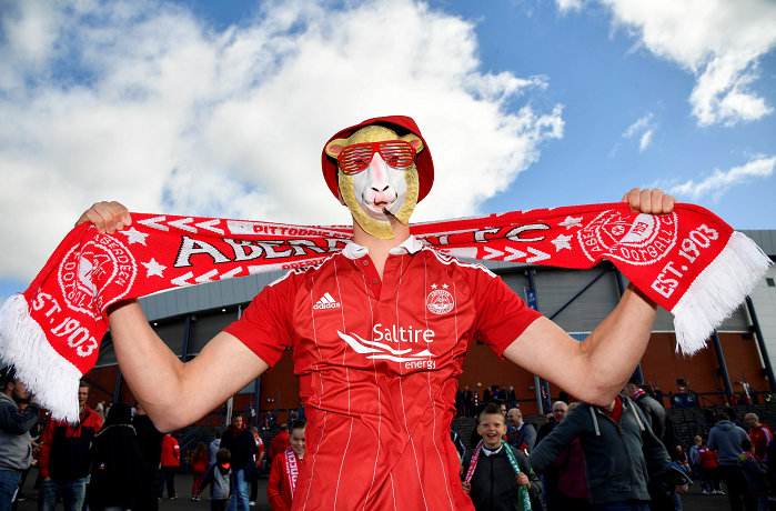 An Aberdeen supporter is pictured pre-match