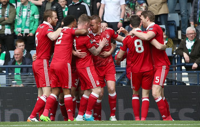 Rooney (centre) celebrates with his teammates   Andrew Milligan/PA Wire