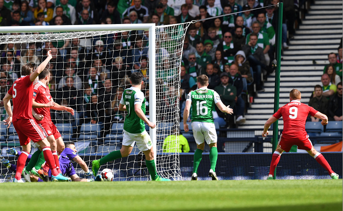 Hibs goalkeeper Ofir Marciano cannot prevent Ryan Christie's cross from crossing the line
