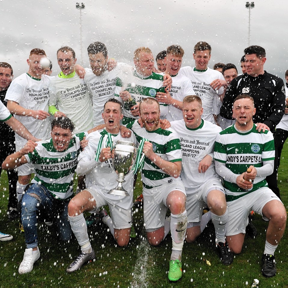 The Buckie players celebrate their title win