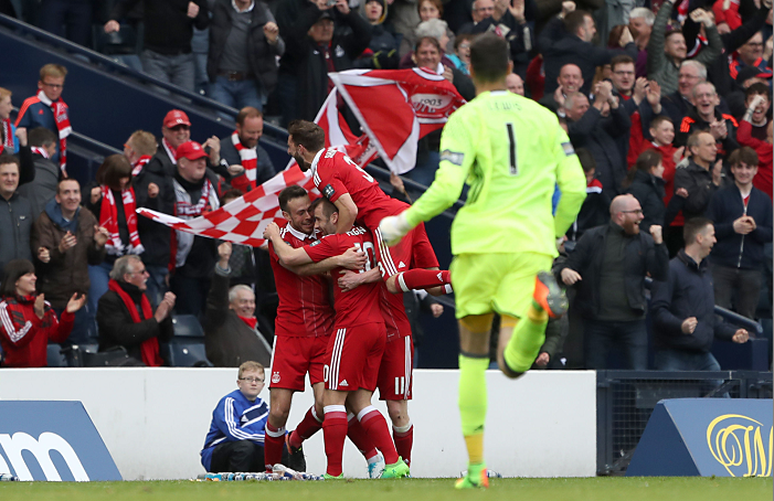 Aberdeen players celebrate Hibernian's Darren McGregor scoring an own goal