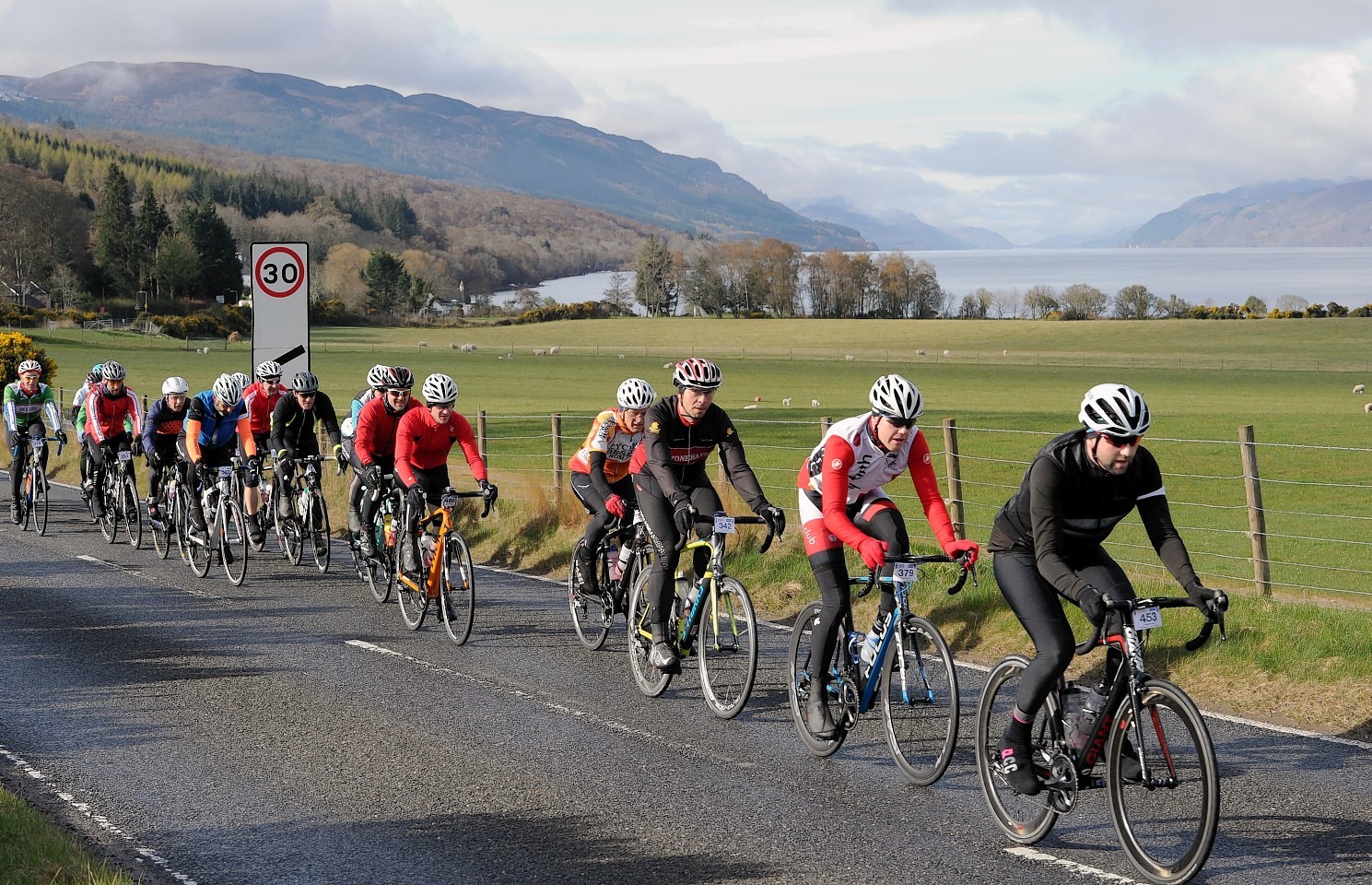 Cyclists pass through Dores on the 2016 Etape Loch Ness