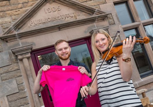 Fiddle instructors Jack Smedley and Mhairi Marwick outside the refurbished Fochabers Institute.