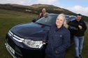 Pictured are Andy Cooper (Go Golspie board member), Tracey Campbell (event organiser) and John Murray (chairman of Go Golspie), with one of the 4x4s that will make the trip