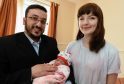 Maria Fowler is teaching Syrian couple to speak english and named their new born after her. in the picture are from left: Omar Al-Hamdan, Manar Omar and Maria Fowler.
