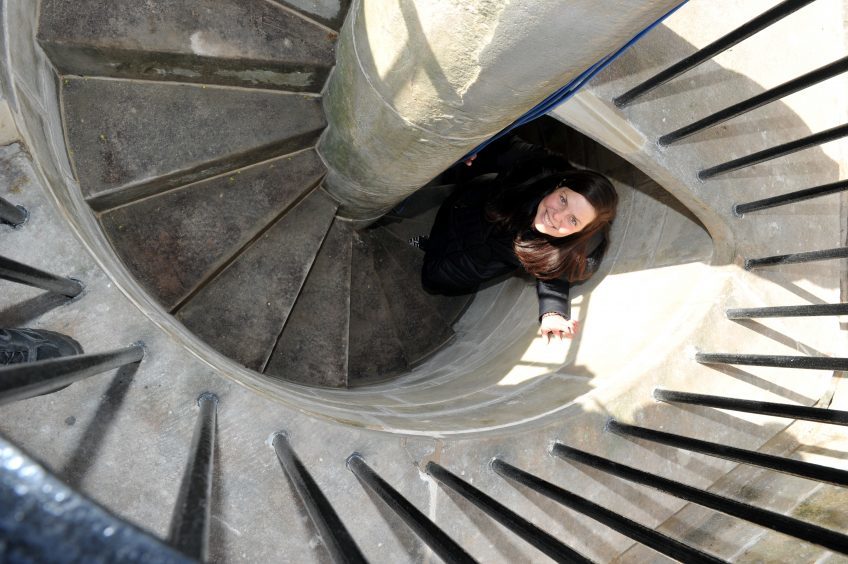 Ellen Cox inside the refurbished Muckle Cross.