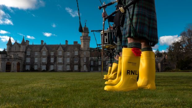 Traditional pipe band footwear is replaced to support the RNLI's mayday campaign