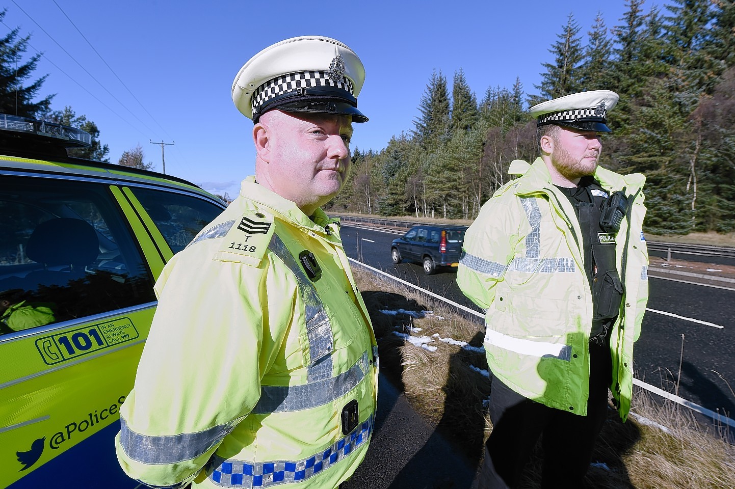 Sergeant Chris Murray and Constable Chris Donaldson beside the A9