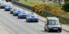 Funeral cortege for Kieran McQuillan, led by hearse and Subaru cars from Elgin Town Hall to Lossiemouth cemetery.