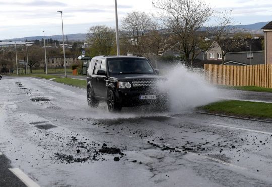 Burst watermains and damage to the road on Westhill Drive.