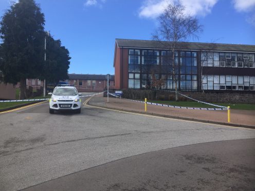 A police car sits guard in front of Banchory Academy