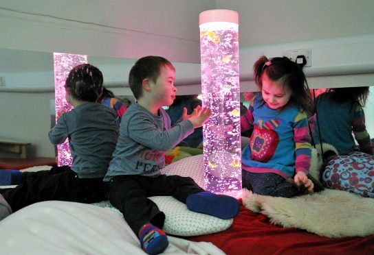 Dominic Davies and Lola Henderson inside the sensory room.
Pictures by Gordon Lennox