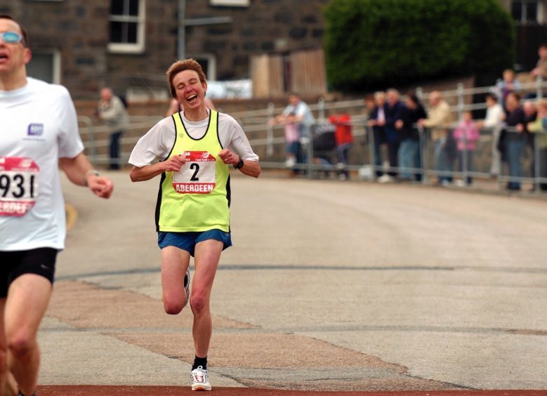 Jane Barker crosses the finishing line for first place in the ladies race in 2005.